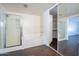 Bathroom featuring a shower, soaking tub, and access to a walk-in closet at 1202 W Central Ave, Coolidge, AZ 85128