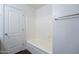 This bathroom features a tub, and tile surround at 1202 W Central Ave, Coolidge, AZ 85128