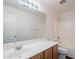 Bathroom with a white vanity, a large mirror, and a shower-tub combo at 1202 W Central Ave, Coolidge, AZ 85128