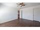 The bedroom opens to the hall and has a ceiling fan at 1202 W Central Ave, Coolidge, AZ 85128