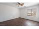 A bedroom featuring wood flooring and natural lighting at 1202 W Central Ave, Coolidge, AZ 85128