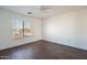 This bedroom has wood flooring and a window for natural light at 1202 W Central Ave, Coolidge, AZ 85128