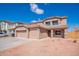 Charming two-story home featuring a tile roof, large garage, and a well-maintained gravel front yard at 1202 W Central Ave, Coolidge, AZ 85128