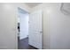 Bright hallway with doors leading to a bathroom and bedroom at 1202 W Central Ave, Coolidge, AZ 85128