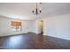 Inviting living room features hard surface floors, neutral decor, and ample natural light at 1202 W Central Ave, Coolidge, AZ 85128