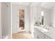 Bright bathroom features white cabinetry, double sink vanity, and lots of natural light at 12083 E Wethersfield Dr, Scottsdale, AZ 85259