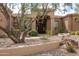 Beautiful home exterior with desert landscaping and mature trees at 12083 E Wethersfield Dr, Scottsdale, AZ 85259