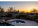 Relaxing spa surrounded by desert vegetation at sunset at 12083 E Wethersfield Dr, Scottsdale, AZ 85259