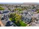 High aerial view of neighborhood showcasing well-maintained homes, landscaping, and trees with mountain backdrop at 1222 W Baseline Rd # 116, Tempe, AZ 85283