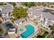 Aerial view of a community pool, hot tub, and well-maintained grounds within a residential neighborhood at 1222 W Baseline Rd # 116, Tempe, AZ 85283