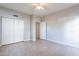 A spacious bedroom features tile floor, a closet with sliding doors, neutral paint, and a ceiling fan at 1222 W Baseline Rd # 116, Tempe, AZ 85283