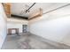 A functional garage with a concrete floor, water heater, desk, and plenty of available space for storage and vehicles at 1222 W Baseline Rd # 116, Tempe, AZ 85283