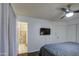 Cozy bedroom featuring a modern ceiling fan, neutral colors, and ensuite bathroom access at 1340 E Townley Ave, Phoenix, AZ 85020