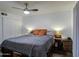 Bright bedroom featuring a modern ceiling fan, neutral colors, and comfortable furnishings at 1340 E Townley Ave, Phoenix, AZ 85020