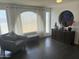 Bright living room with large window, decorative privacy glass, and a stylish accent chair at 1340 E Townley Ave, Phoenix, AZ 85020