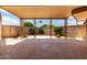 A cozy back porch with decorative metal beam supports and patterned concrete at 13677 N 108Th Dr, Sun City, AZ 85351