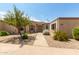 Inviting single-story home featuring a walkway to a decorative metal gate, desert landscaping and neutral paint color at 13677 N 108Th Dr, Sun City, AZ 85351