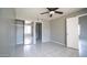 Bedroom with tile flooring, a ceiling fan, and a mirrored closet at 1432 W Emerald Ave # 712, Mesa, AZ 85202