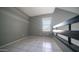 Neutral and bright loft living space with modern metal railing and large window at 1432 W Emerald Ave # 712, Mesa, AZ 85202