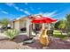 Serene backyard featuring patio area, desert landscaping, an umbrella and shade at 14385 W Morning Star Trl, Surprise, AZ 85374