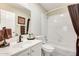 Full bathroom with shower/tub combo, white tile, and modern fixtures at 14385 W Morning Star Trl, Surprise, AZ 85374