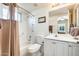 Bright bathroom with white cabinets, shower-tub combo, and neutral color scheme at 14385 W Morning Star Trl, Surprise, AZ 85374