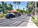 View of the community entrance, with security gate, landscaping, and a waterway at 14385 W Morning Star Trl, Surprise, AZ 85374