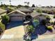 Aerial view of home showcasing desert landscaping, tile roof and paved driveway at 14385 W Morning Star Trl, Surprise, AZ 85374