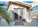 Welcoming front entrance with gated courtyard and double doors providing an inviting approach to this home at 14385 W Morning Star Trl, Surprise, AZ 85374