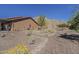 View of the house with desert landscaping and scenic mountain backdrop at 1440 W Christie Lyn Ln, San Tan Valley, AZ 85144