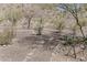 Enjoy serene desert views from this home's backyard with low-maintenance landscaping and a covered patio area at 1440 W Christie Lyn Ln, San Tan Valley, AZ 85144