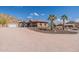 Spacious home with a covered parking area and desert landscaping at 1440 W Christie Lyn Ln, San Tan Valley, AZ 85144