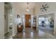 Inviting foyer with high ceilings, stylish decor, and a grand wooden front door at 1440 W Christie Lyn Ln, San Tan Valley, AZ 85144