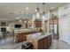 Spacious kitchen featuring an island, stainless steel appliances, granite countertops and open floor plan at 1440 W Christie Lyn Ln, San Tan Valley, AZ 85144