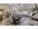 Spacious living room with a fireplace, neutral tones, and plenty of natural light at 1440 W Christie Lyn Ln, San Tan Valley, AZ 85144