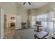 Bright, open living room with a doorway, table, and light wood flooring at 1440 W Christie Lyn Ln, San Tan Valley, AZ 85144