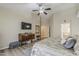 Spacious main bedroom featuring a ceiling fan, plank flooring, and decorative furnishings at 1440 W Christie Lyn Ln, San Tan Valley, AZ 85144