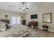 Bright main bedroom with neutral paint, plank flooring, and decorative vintage furnishings at 1440 W Christie Lyn Ln, San Tan Valley, AZ 85144