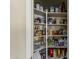 Pantry with stocked shelves holding a large assortment of canned and dry goods at 1440 W Christie Lyn Ln, San Tan Valley, AZ 85144