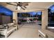 Relaxing back patio featuring a ceiling fan, comfortable seating, and a view of the pool at 15273 N 92Nd Pl, Scottsdale, AZ 85260