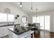 Bright kitchen featuring stainless appliances and quartz counters with pendant lighting at 15273 N 92Nd Pl, Scottsdale, AZ 85260