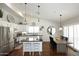 Bright kitchen featuring stainless appliances and quartz counters, plus dining area at 15273 N 92Nd Pl, Scottsdale, AZ 85260