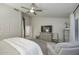 Large main bedroom with neutral tones, lots of natural light, and a ceiling fan at 15273 N 92Nd Pl, Scottsdale, AZ 85260