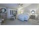 Cozy main bedroom featuring neutral tones, large windows, ample closet space, and a ceiling fan at 15273 N 92Nd Pl, Scottsdale, AZ 85260