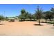 Community park sand area with shade covering, trees and sports fields at 15273 N 92Nd Pl, Scottsdale, AZ 85260