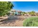 Picturesque backyard showcasing a well-maintained landscape with stone features, offering a tranquil outdoor ambiance at 15840 W Falcon Ridge Dr, Sun City West, AZ 85375