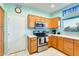 Kitchen featuring stainless steel appliances, oak cabinets and natural light at 15840 W Falcon Ridge Dr, Sun City West, AZ 85375