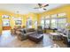 Bright living space showcasing colorful walls, tile floors, and an open layout to the dining area at 15840 W Falcon Ridge Dr, Sun City West, AZ 85375