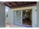 Balcony view through sliding glass doors leading to kitchen with stainless steel appliances and light cabinetry at 16807 E Gunsight Dr # B18, Fountain Hills, AZ 85268