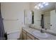 Bright bathroom featuring a vanity with countertop space, a medicine cabinet, and a shower-tub combo at 16807 E Gunsight Dr # B18, Fountain Hills, AZ 85268